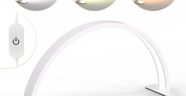 A modern nail desk lamp illuminating a manicure station