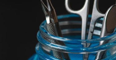 Barbicide disinfectant solution used in a nail salon for sanitation