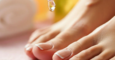A close-up of freshly pedicured feet with vibrant nail polish