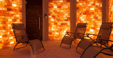 A serene salt therapy room with Himalayan salt walls and comfortable seating