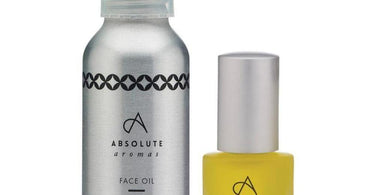 Absolute Aromas Rejuvenate Face Oil bottle, a luxurious anti-aging facial oil with frankincense and rosehip for spa professionals.