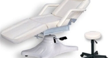 Alvida Hydraulic Facial Chair with matching stool in a spa setting, featuring black and beige upholstery.