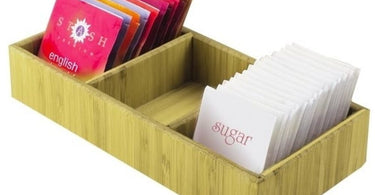 Bamboo 3 Compartment Tray on a spa counter with neatly arranged skincare products and a plant.