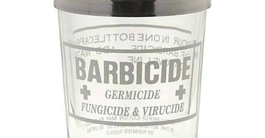 Barbicide Jar used in a salon setting for disinfecting tools