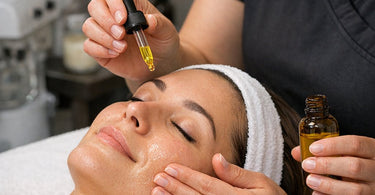 Lemon oil being poured into a professional cleaning spray bottle on a salon counter with spa tools