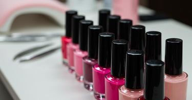 Assortment of professional nail polish bottles in a salon setting