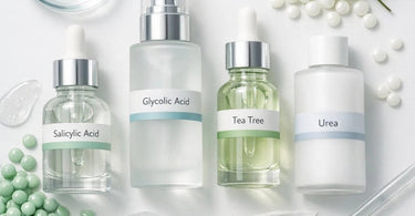 Illustrative icons representing four key waxing retail ingredients: salicylic acid, glycolic acid, tea tree, and urea, on a soft pink background for a blog post on Pure Spa Direct.