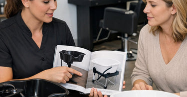 Close-up of a professional portable shampoo basin with ergonomic neck rest and removable sprayer on a wheeled cart