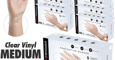 Case of 10 boxes of clear vinyl disposable gloves, medium size, 100 per box, 1000 total gloves, displayed on a clean white surface for professional salon and spa use.