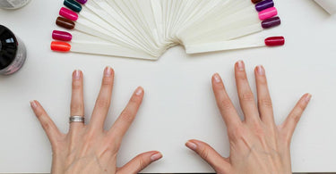 Nail technician applying vibrant gel polish to a client's nails in a modern salon setting