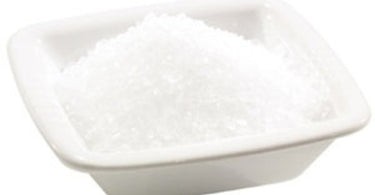 Professional one pound bag of Body Concepts Epsom Salt on a spa towel with dried lavender.