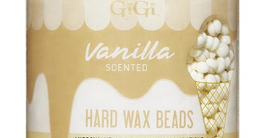 GiGi Vanilla Scented Hard Wax Beads in a 10 oz jar with pink applicator sticks for professional salon and spa use.