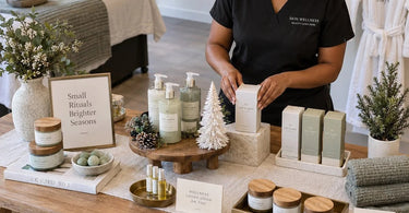 Elegant seasonal retail table from Pure Spa Direct featuring organized, non-cluttered spa and beauty products with decorative elements.