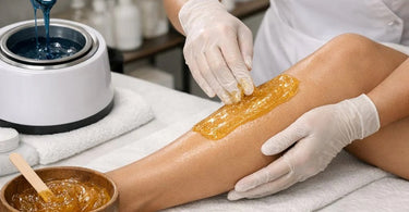 Hard wax and sugaring paste supplies arranged on a salon counter for a diverse hair removal menu