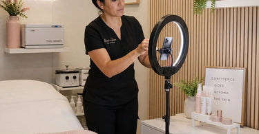 Stylish small salon photo area with ring light and neutral backdrop, perfect for social media content creation.