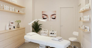 Minimalist lash studio design with neutral tones, sleek furniture, and soft lighting