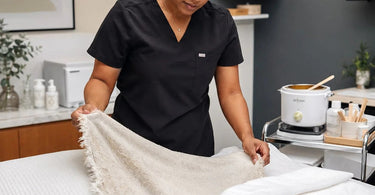 A close-up image showing worn and frayed spa linens, highlighting the signs that indicate when towels and sheets are too worn for clients.