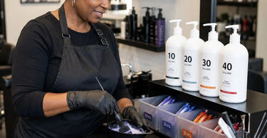 Professional hair color mixing station with organized developer volumes for efficient salon workflow.