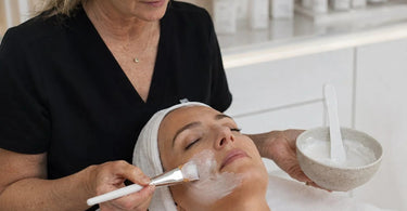 A collage of spa items like a wooden spatula, clay mask, and towel arranged artistically with text overlay reading How To Prevent Product Drips During Mask Application