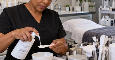 Professional spa and salon product containers arranged in a clean dry backbar area to help prevent water contamination
