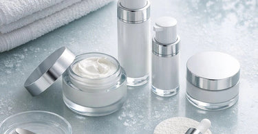 A serene spa treatment showing rich barrier repair cream being gently massaged onto hydrated, glowing client skin during a winter facial