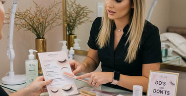 Close-up of beautifully applied lash extensions with a spoolie brush and lash cleanser