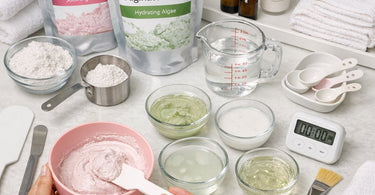 Professional mixing alginate mask in a silicone bowl with spatula at Pure Spa Direct