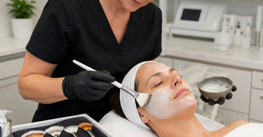 How to select the right facial fan brush for mask texture, professional esthetician applying facial mask with fan brush in spa