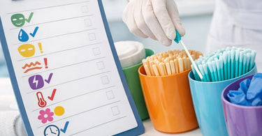 A neat, organized spa workstation featuring a clipboard with a single-use product log, surrounded by sealed packs of disposable applicators, cotton pads, and other hygiene essentials.