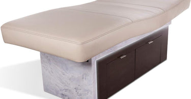 Insignia Waterfall Multi-Purpose Spa Treatment Table by Living Earth Crafts in a modern spa setting