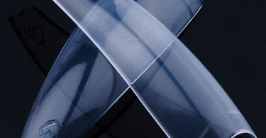 Lamour Coffin Nail Tips in edgy square shape, clear color, box of 100, displayed on a clean background, perfect for professional nail enhancements and acrylic nail art.