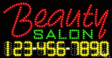 LED Sign - Beauty Salon mounted on wall displaying bright white lettering in a professional salon setting