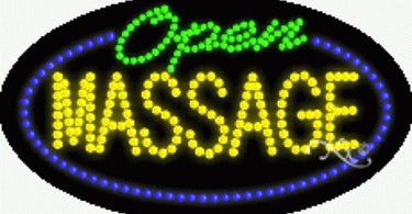 Bright LED Massage Open sign for spas and salons, measuring 15 inches high by 27 inches wide, displayed in a storefront window.