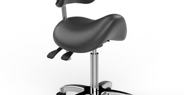 Maja Hydraulic Saddle Stool in black shown in a modern spa setting
