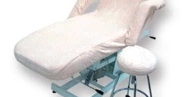 Meishida Terry Cloth Bed Cover Set shown on a massage table in a spa setting