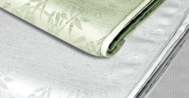 Simon West Microfiber Runner in White Bamboo White 19x73 inches displayed on a massage table showcasing its elegant and practical design for spa and salon use.