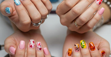 Seasonal nail designs featuring winter snowflakes and glittery accents