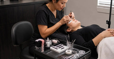 Illustration showcasing an optimized ergonomic lash studio layout with proper lighting and furniture for solo lash artists.