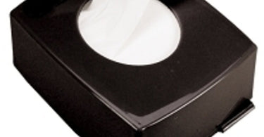 Gray paraffin strips dispenser on a clean salon counter, showing neat stack of wax strips ready for professional use