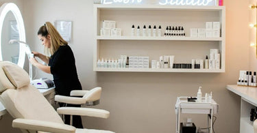 Lash extension studio setup with comfortable treatment bed and organized supplies