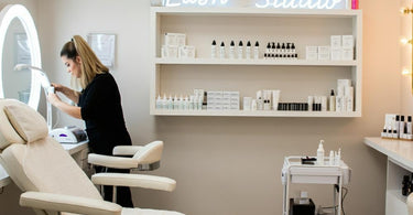Lash extension studio setup with comfortable treatment bed and organized supplies