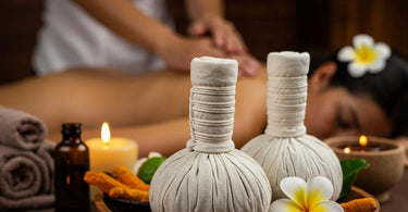 Sa-wan luxury spa treatment setup with essential oils, candles, and towels