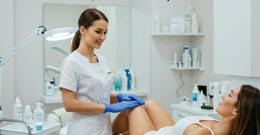 Wax technician providing professional service to a client