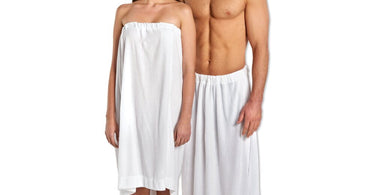 Scalpmaster white terry cloth spa wrap with velcro closure shown on massage table