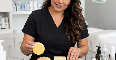 Professional grade sponges of varying porosity on a spa treatment table.