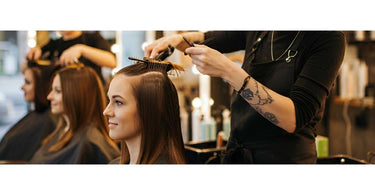 A variety of salon tools including shears, soaps, and other essential supplies