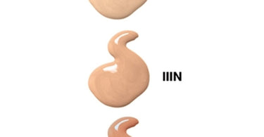 Mirabella Skin Tint Creme in IIIN shade shown alongside professional makeup brushes