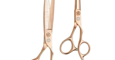 Rose gold professional hair cutting shears with sleek design, perfect for stylists and barbers