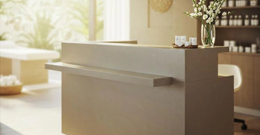 Harlow Glass-Topped Compact Reception Desk in a modern salon setting