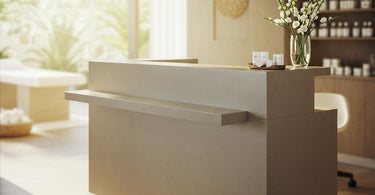 Harlow Glass-Topped Compact Reception Desk in a modern salon setting